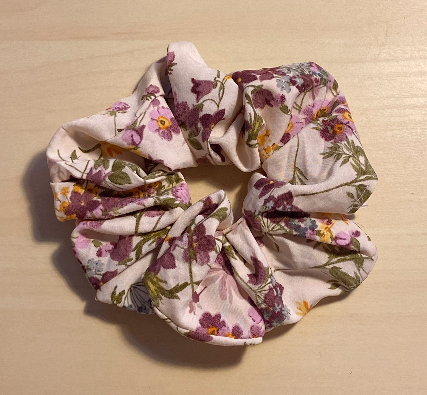 close up flat lay image of lovely lavender scrunchie 