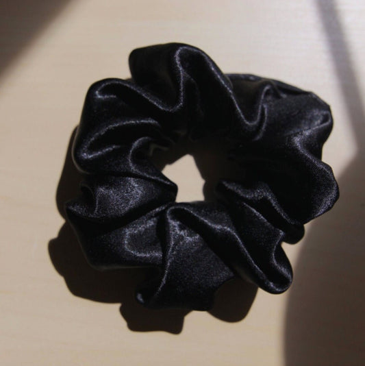 close up flat lay  image, black satin scrunchie