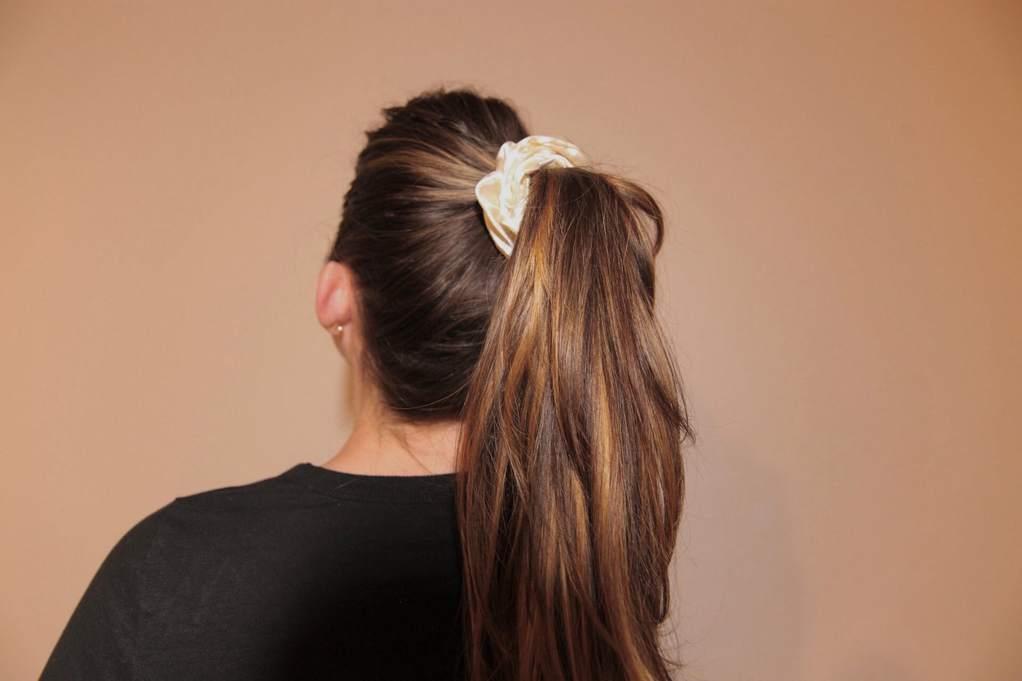 close up image, high ponytail featuring french vanilla satin scrunchie 