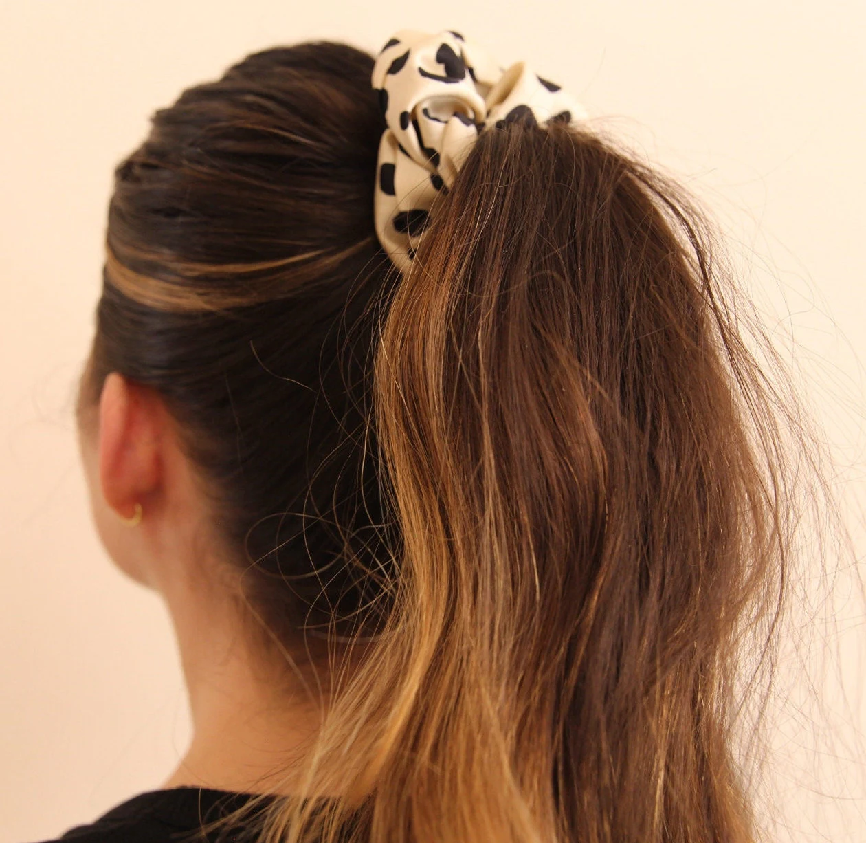 close up image, high ponytail featuring satin polka dot scrunchie