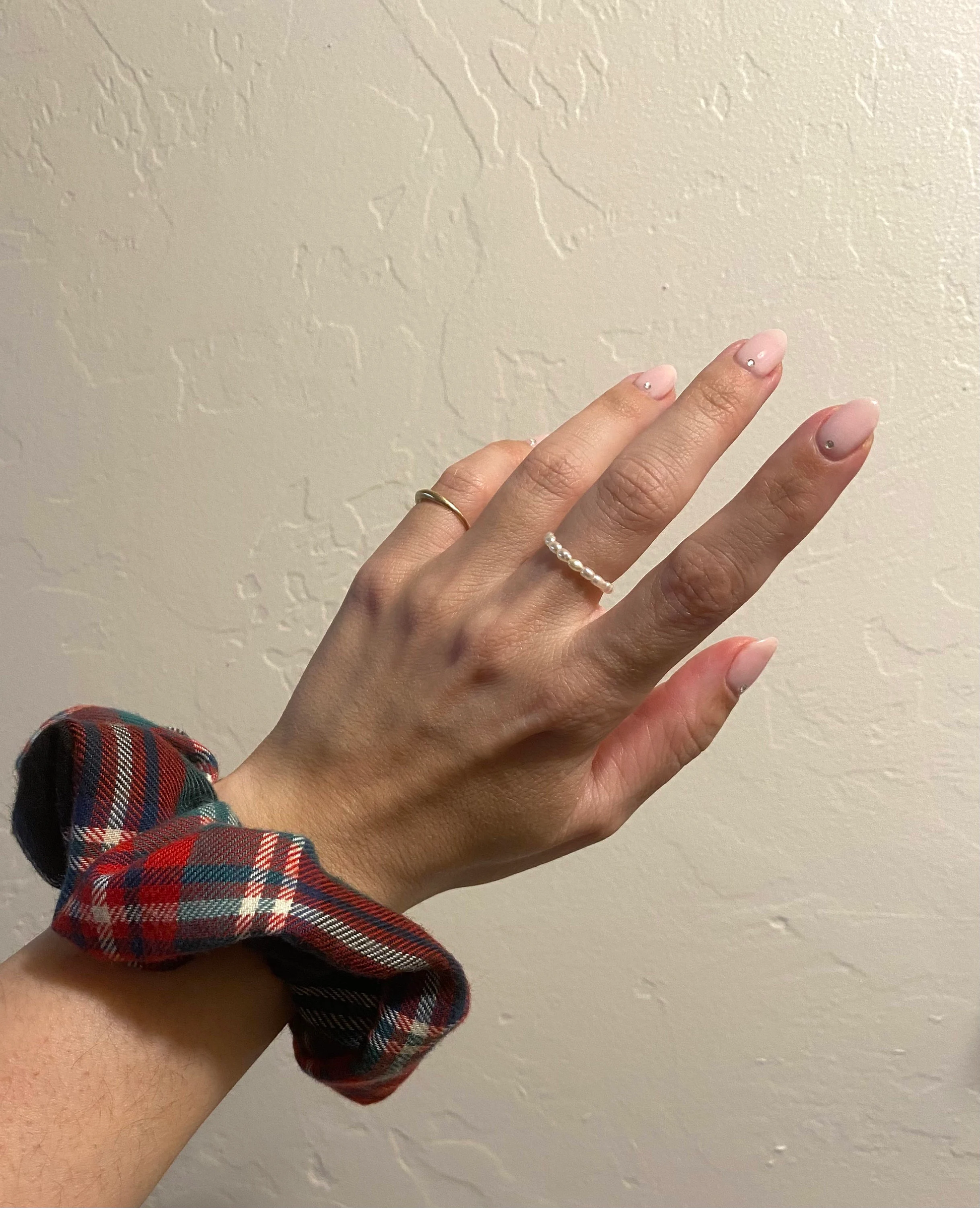 evergreen tartan scrunchie modeled on wrist