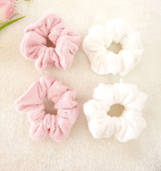 flat lay image of pink and white towel scrunchies.